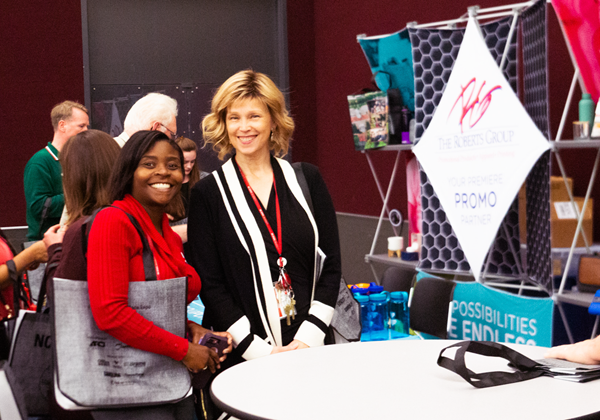Vendors and employees visit the booths at the MarketPlace Expo.