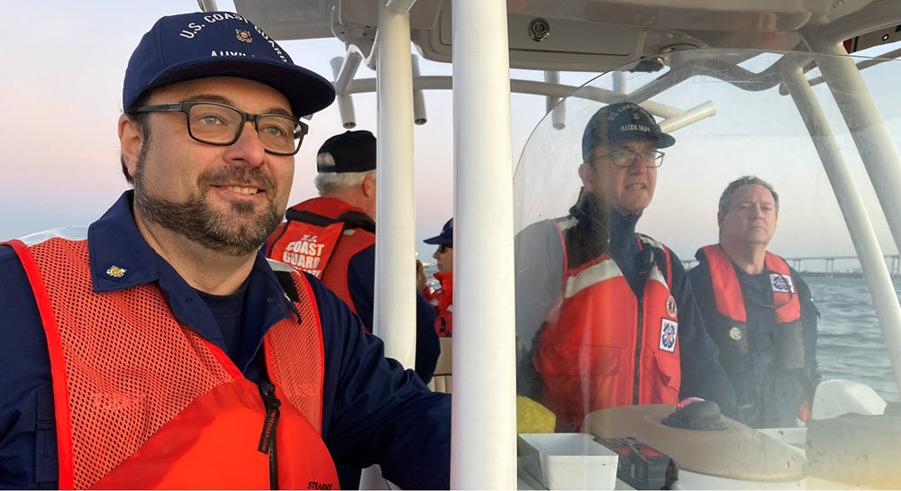 Justo Torres, Director of the Office of Contracts and Grants, on a Coast Guard vessel