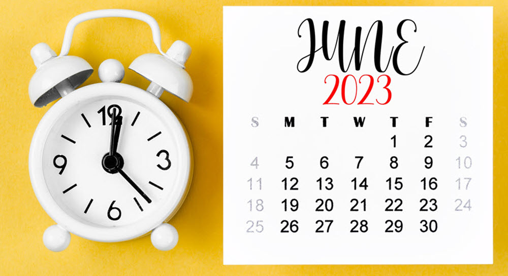 A decorative image showing a white alarm clock and a June 2023 calendar