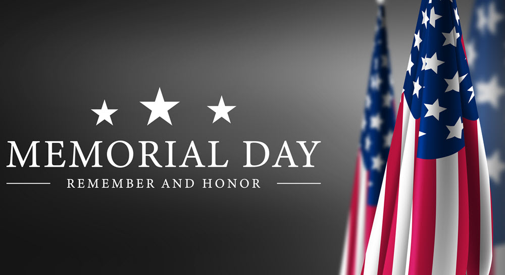 A decorative image commemorating Memorial Day. American Flags stand to the right of text that states, "Memorial Day: Remember and Honor."