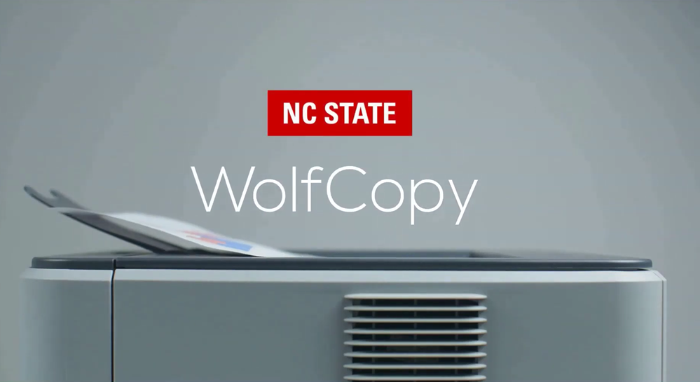 A multifunction printer with an NC State brick logo and the word "WolfCopy" displayed above it