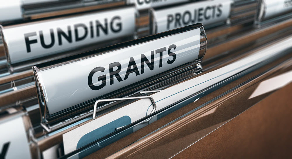 File folders labeled "grants," "funding" and "projects"