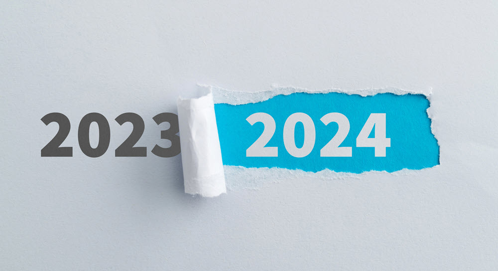 A calendar with 2023 ripping to reveal the year 2024