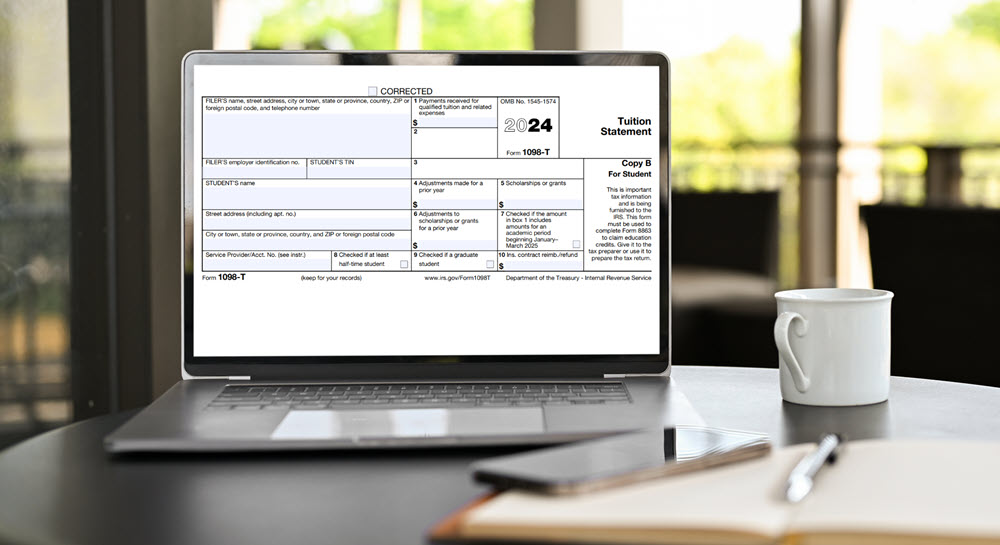 A laptop computer displaying a 2024 Tuition Statement Form