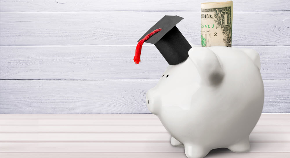 piggy bank with graduation cap on