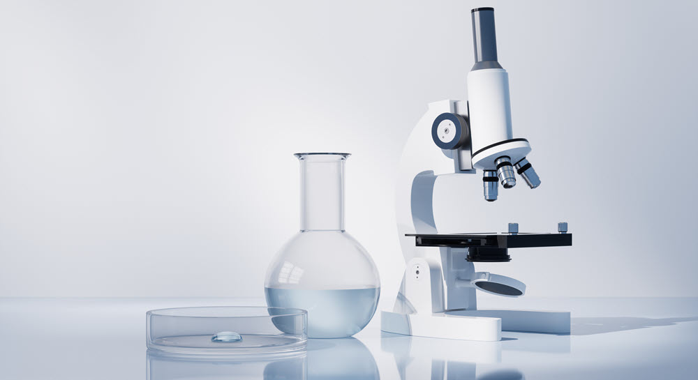 A petrie dish, beaker, and microscope
