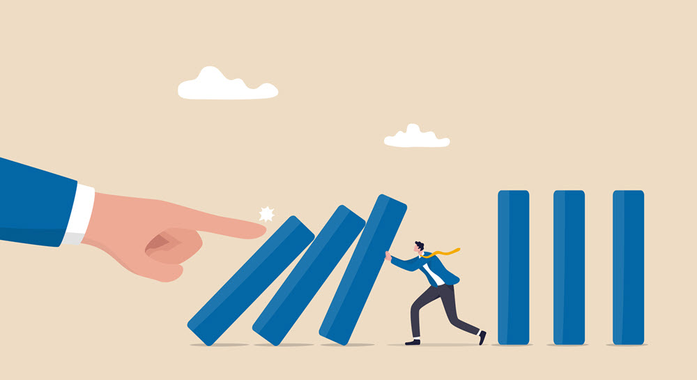 A large hand pushing over a stack of blue blocks and a small person holding up three blocks and preventing them from falling
